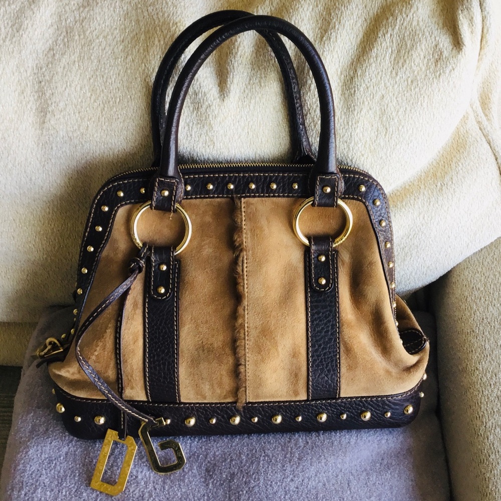 Dolce & Gabbana suede bag with gold details.